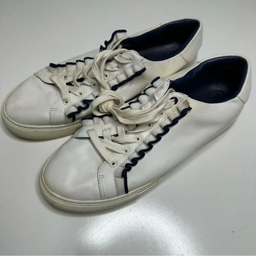 Tory Burch Ruffle sneakers. Size 10M. White with elegant‎ black ruffle.